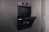 Modern home with Kitchen and Wall Oven. The Dacor Combination Speed Oven combines the speed of microwave convection in the upper-oven with fast and healthy steam-roasting and steam-baking features in the lower-oven. Photo of The Modernist Collection by Dacor