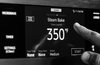 Modern home with Kitchen and Range. The Dacor Wi-Fi-enabled seven-inch LCD Touchscreen puts cutting-edge kitchen technology at your fingertips. Photo of The Modernist Collection by Dacor