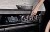 Modern home with Kitchen and Range. With the touch of your finger, the Dacor Illumina knobs light up and the Wi-Fi-enabled seven-inch LCD Touchscreen interface comes to life, complete with pre-programmed guided cooking presets. Photo of The Modernist Collection by Dacor