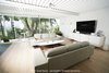 Modern home with Living Room, Sofa, Ceiling Lighting, Wall Lighting, Console Tables, Coffee Tables, Media Cabinet, and Light Hardwood Floor. "Midcentury-modern homes can suffer from too many ambitious owners trying to improve their homes. Mostly, these attempts do more harm than good, and can even distort the original design," says Nikolaus. Photo 7 of Pierre Koenig's Scott House
