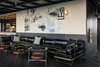 Modern home with Living Room, Chair, Coffee Tables, Sectional, and Wall Lighting. Dining options include a restaurant called City Mouse and a cafe by Stumptown Coffee Roasters, which is their first Midwest location. Photo 10 of Ace Hotel Chicago