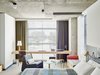 Modern home with Bedroom, Bench, Bed, Chair, Lamps, Wall Lighting, Ceiling Lighting, Carpet Floor, and Table Lighting. Each room comes with a unique piece of art on letterhead stationery that's painted or hand-drawn by a student at the Chicago Art Institute. Photo of Ace Hotel Chicago