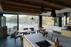 Modern home with Kitchen, Marble Counter, Pendant Lighting, and Undermount Sink. The kitchen features Japanese ash casework and Jacques Biny lights, made in 1956. A Semi pendant by Gubi hangs above a De La Espada table. Photo 5 of Haiku House