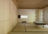 Modern home with Shed & Studio and Sun Room Room Type. The new interior includes a meditation room with an Isamu Noguchi lamp, flooring made of tatami mats, and a Murphy bed for visitors. Photo 10 of Haiku House