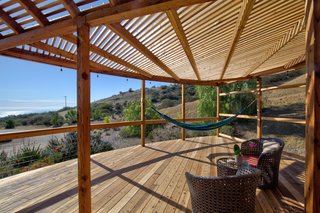 The deck has multiple lounge areas, including two hammocks, and would make a great space for morning or evening yoga.