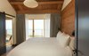 Timber cover master bedroom featuring king sized bed and ocean views. Photo of Timber Cove Inn modern home