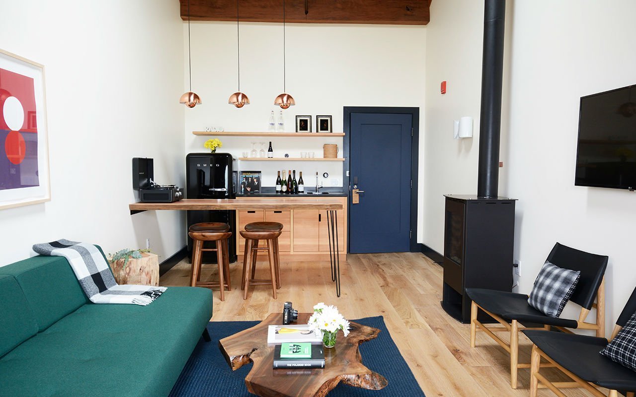 The Endless Pacific Ocean view suite, located in the main building surrounding the Great Room, is a spacious suite with living room and separate bedroom, double-wide redwood deck, wetbar with breakfast table, fireplace, sleeper sofa and hand-crafted king bed.