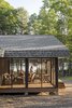 Modern home with Exterior, Glass Siding Material, House Building Type, Shingles Roof Material, and Wood Siding Material. The cottage stretches for more than 110 feet, with a Muskoka room, or screened-in porch, at the northwestern end. Photo 5 of House on Lake Havelock