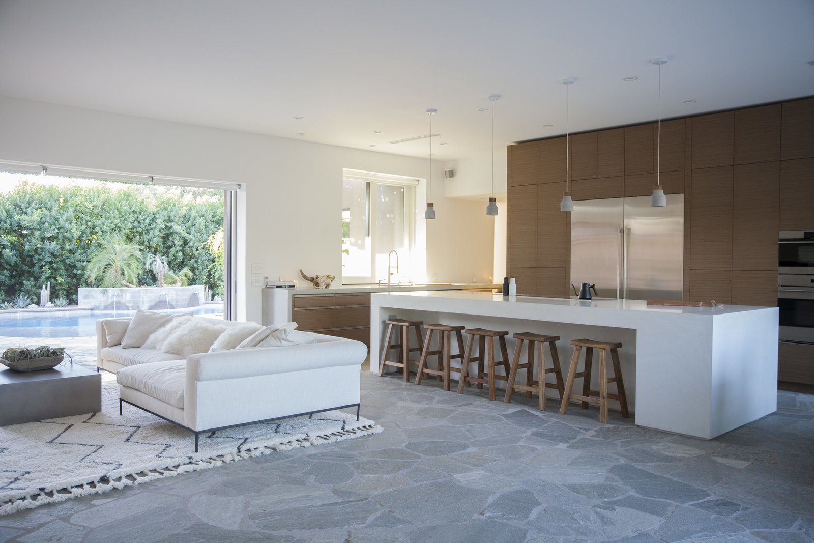 The kitchen features state-of-the-art appliances and accessories. The custom cabinetry is by Woodcase Fine Cabinetry and the appliances by Sub-Zero, Wolf, and Asko.