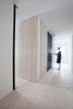 Modern home with Hallway and Light Hardwood Floor. Studio für Architektur Bernd Vordermeier was brought in to design the apartments, as well as new living spaces for Reinhold and his wife, Verena, and his parents. Photo 3 of Moosham 13