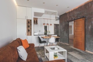 When selecting your Urban door, go with something industrial; something heavy and metallic, like this painted, molded panel barn door. It will anchor your space in its urban setting. 