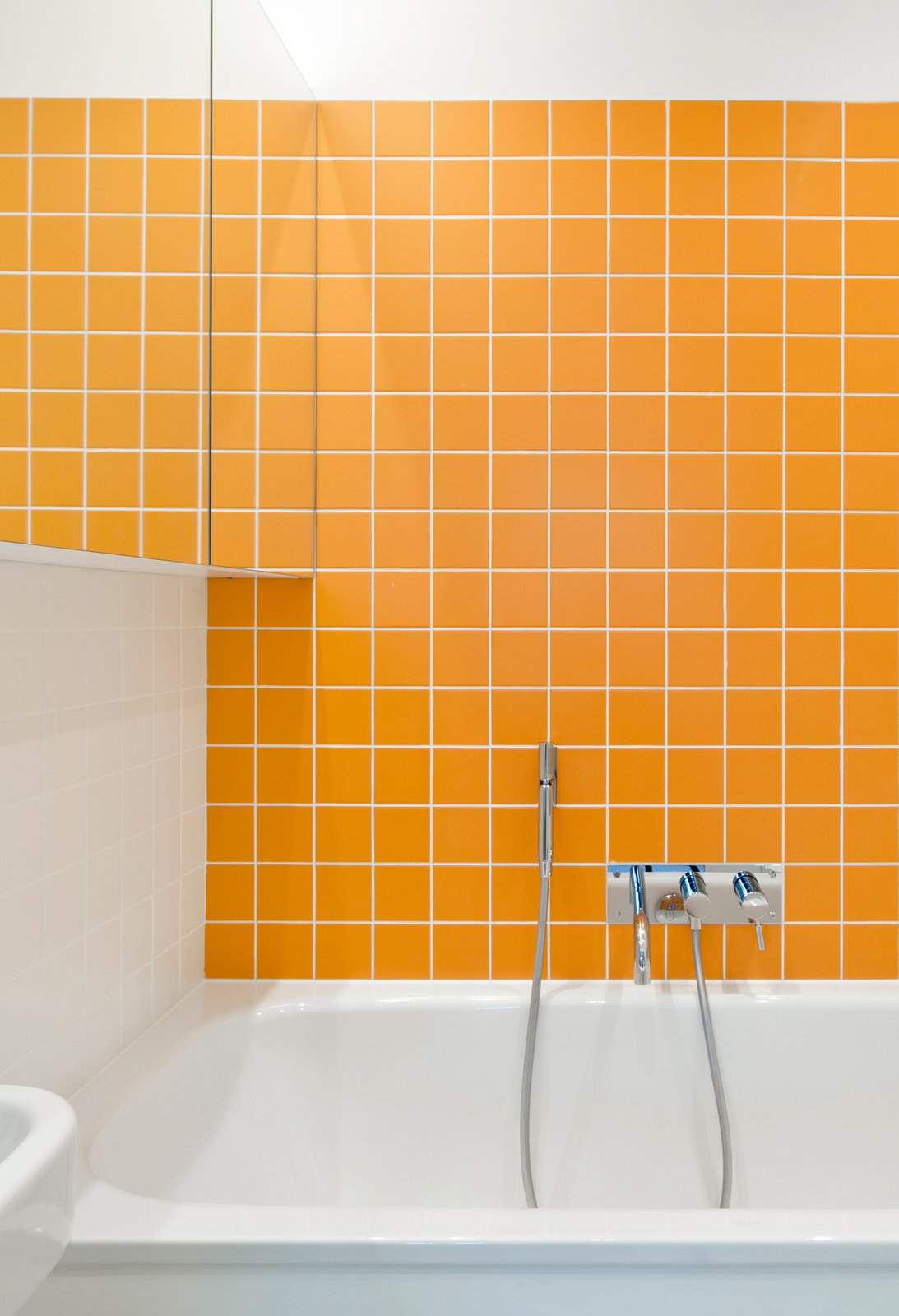 Bath Ceramic Tile Photos from Loads of Color Define a Revamped 1960s