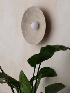 Expertly crafted from American hardwoods and brass, the Concentric wall- or ceiling-mounted light is a testament to Allied Maker's mastery of precision and detail. "I love how the light plays in the waves of the material," says Lanette. "A lot of our composition has to do with how light is thrown from the object and plays with its environment." 