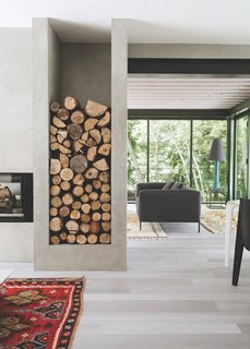 Built-in storage for firewood allows the homeowners to stack logs by the fireplace.