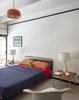 Modern home with Bedroom, Chair, Carpet Floor, Bed, and Ceiling Lighting. A Diamond chair by Harry Bertoia for Knoll sits in the guest bedroom. Photo 12 of The Ellison House