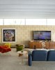 Modern home with Living Room, Coffee Tables, Sectional, and Carpet Floor. A print of Jean Michael Basquiat's "Head Photo 19 of The Ellison House