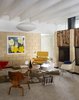 Modern home with Living Room, Carpet Floor, Standard Layout Fireplace, Chair, Coffee Tables, and Ceiling Lighting. Artist Christopher Florentino says his respect for Gene Leedy drove his update of the architect’s 1963 Ellison Residence in central Florida: “Being original is important to me. I don’t want Gene Leedy to come here and be like, ‘Damn, you killed my vision.’” In the living room, George Nelson’s Saucer Bubble pendant hovers over Eames classics, like an LCW chair, a Molded Fiberglass armchair, and a Molded Plywood coffee table. Christopher found the lounge, an Eames replica, in a dumpster and couldn’t let it go to waste. A Warhol print hangs from the sandstone block wall; the Ekko mobile is by Matthew Richards. Photo 2 of The Ellison House