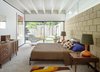 Modern home with Bedroom, Bed, Carpet Floor, Chair, Lamps, and Dresser. In the master bedroom, the dresser and the bedside tables are by American of Martinsville. An Eames La Chaise lounge occupies a spot near the sliding glass doors. Photo 5 of The Ellison House