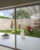 Modern home with Outdoor and Grass. KAWS Companion Figure. Photo 16 of The Ellison House
