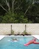 Modern home with Outdoor, Back Yard, and Swimming Pools, Tubs, Shower. A Jeff Koons lobster joins a float by the artist KAWS in the pool. Photo 9 of The Ellison House
