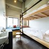 Modern home with Bedroom, Bunks, Storage, Pendant Lighting, and Carpet Floor. The Share Hotels Hatchi Kanazawa in Kanazawa, Japan Photo 12 of The Share Hotels Hatchi Kanazawa