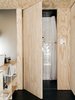 The frosted glass wall between the kitchen and the bathroom, which distributes light while protecting privacy, cost $160. Photo 15 of Elsewhere Cabin Retreat modern home