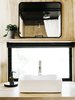 Modern home with Kitchen. The bathroom’s plywood counter, which supports a vessel sink by Fine Fixtures, has a matte polyurethane finish; the flower pot is by Hay and the mirror is from Target. Photo 17 of Elsewhere Cabin Retreat