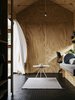 Modern home with Living Room, Pendant Lighting, Vinyl Floor, and Coffee Tables. A Hem table and Muuto rug center the living area. Photo 4 of Elsewhere Cabin Retreat