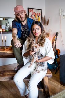 Cyndi with her husband and their pup in their one-bedroom apartment in the West Village. Infused with some of the same chic, calming vibes she’s incorporated at Chillhouse, Cyndi has also designed the space with her husband’s style in mind. "I am more eclectic with my tastes," she explains, "so it’s been a fun process trying to merge our styles into one."
