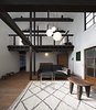 Modern home with Living Room, Floor Lighting, Sofa, Rug Floor, Pendant Lighting, Coffee Tables, Dark Hardwood Floor, and Lamps. Kyomachiya Hotel Shiki Juraku in Kyoto, Japan Photo 2 of Kyomachiya Hotel Shiki Juraku