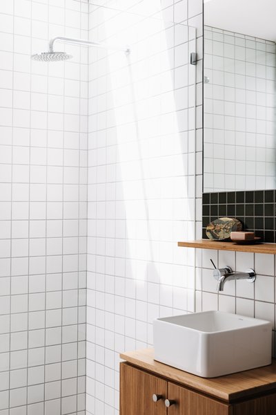 The guest bathroom features Waringa tiles from Johnson Tiles and a Caroma basin.