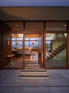 The original entryway, conceived as an aperture to view beyond, was updated with more glass. The street-facing exterior was bumped out four feet toward the road to create additional space.