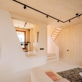 Soft, curved interior shapes continue the maritime motif. 