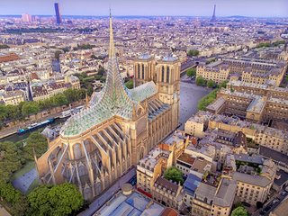 The roof spire would create a thermal buffer to insulate the cathedral in the winter. It would also provide fresh air in the summer through evapotranspiration of the plants below.