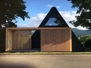 The minimalist A-frame overlooks pristine alpine views.