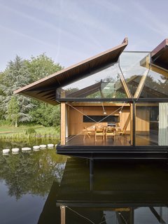 Stilts elevate the new spaces, keeping them clear of flood waters while also making it possible to swim underneath the buildings.