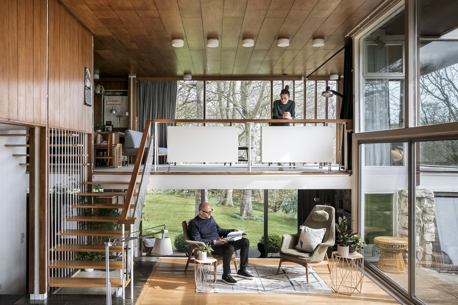 The couple purchased the living room’s H.W. Klein chairs with the house. Another existing piece was the mezzanine’s daybed, designed by Peter Hvidt and Orlando Mølgaard Nielsen. An original floating staircase leads to the mezzanine and then up to the second floor. The open, straight-forward spaces speak to one of Christian’s guiding principles: 