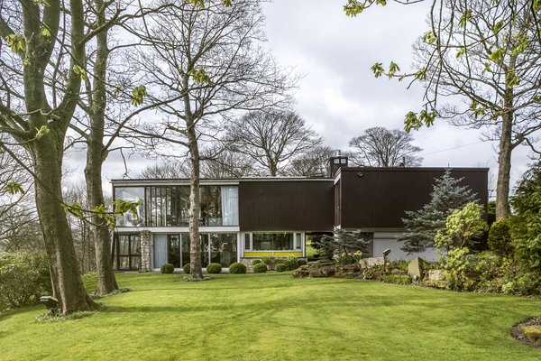 The Farnley Hey house in West Yorkshire has undergone many changes since Peter Womersley designed it in 1954. Christian Harvey and Victoria Davies, the current owners, are working to update the house—and undo some of the previous alterations, including removing the greenhouse inserted under the cantilevered second floor—while staying true to its original aesthetic.