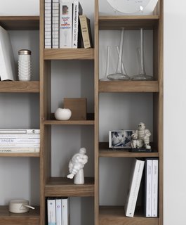 Danish vases, vintage Michelin figures, and cookbooks fill the Originals Furniture Singapore bookshelf.