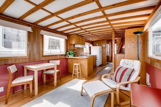 The boat's midcentury-inspired interior features beautiful exposed wood beams.