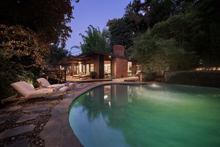 A look at the iconic residence glowing gorgeously at night.