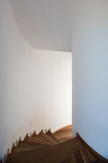 Serving as the structural core, the spiral staircase was built first, before constructing each of the surrounding rooms. 