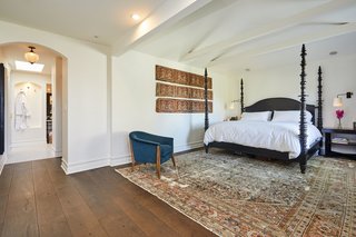 The large master suite takes on a more muted, white color palate. 