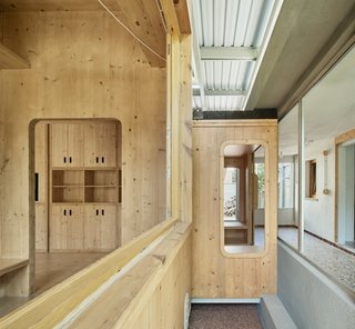 The rounded edges of the living room’s openings correspond to the CNC router used to cut the wood. “It can’t cut straight corners, so we decided to make them curved,” Tapias says.