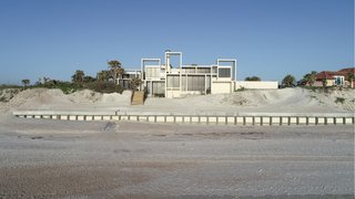 The home is located on a recently restored beachfront site.