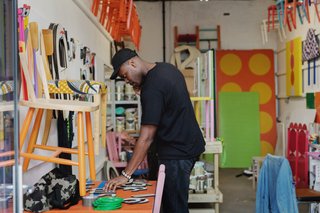 The collaboration between designer Yinka Ilori (pictured) and Dingle Price and Alex Gore of Peckham–based firm Pricegore evolved from a random office visit. Once the two architects popped into Yinka's studio (which they designed) to see how the space was being used, they reached out to the designer, asking if he wanted to be involved in pitching a design for the Dulwich Pavilion competition.