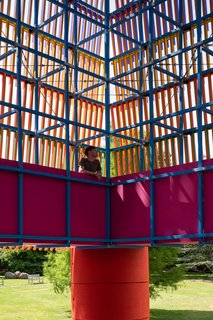 Like a dizzying spatial kaleidoscope, the walk around the raised gantry creates further optical illusions as glimpses of light can also be seen through the layers of colored fringe.