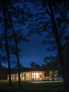 A peek at the Wuehrer House glowing gorgeously at night.