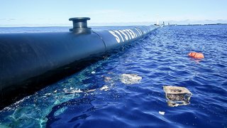 Dubbed "System 001," The Ocean Cleanup's initial design sweeps the ocean's surface for floating debris.