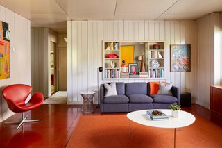 Fitted with eclectic midcentury furniture throughout, the home pays tribute to its historic past.